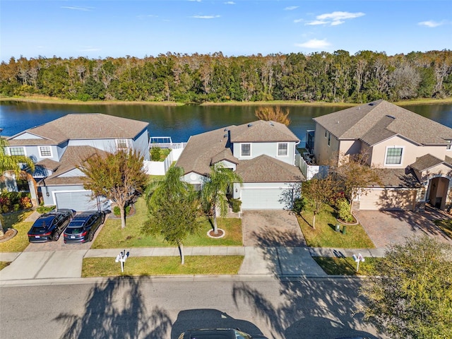 birds eye view of property with a water view