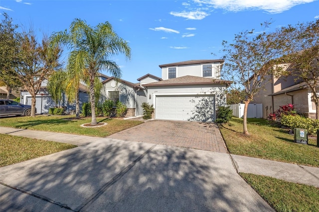 view of front facade with a garage and a front yard