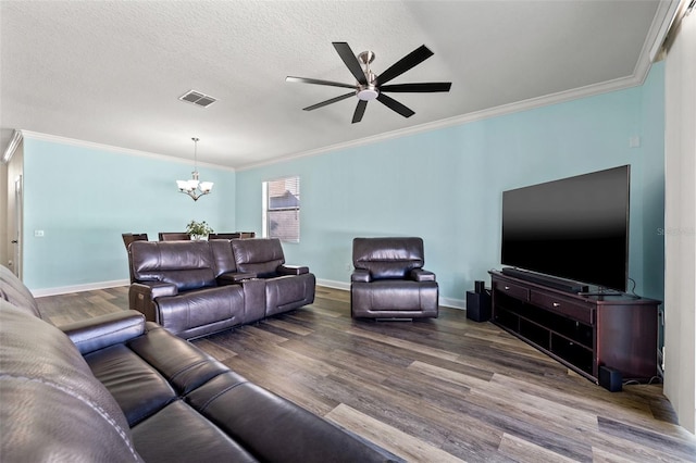 living room featuring crown molding, hardwood / wood-style flooring, ceiling fan with notable chandelier, and a textured ceiling