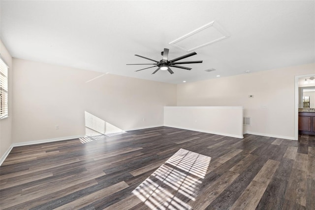 unfurnished living room with dark hardwood / wood-style floors