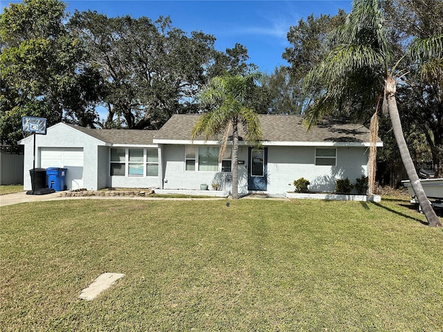 single story home featuring a garage and a front lawn