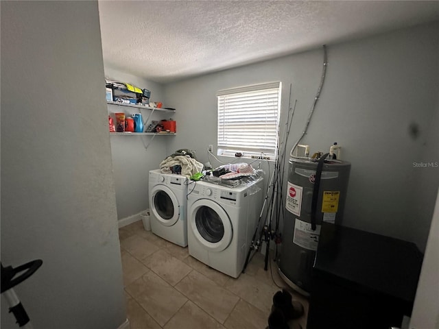 laundry room with independent washer and dryer, electric water heater, a textured ceiling, and light tile patterned flooring