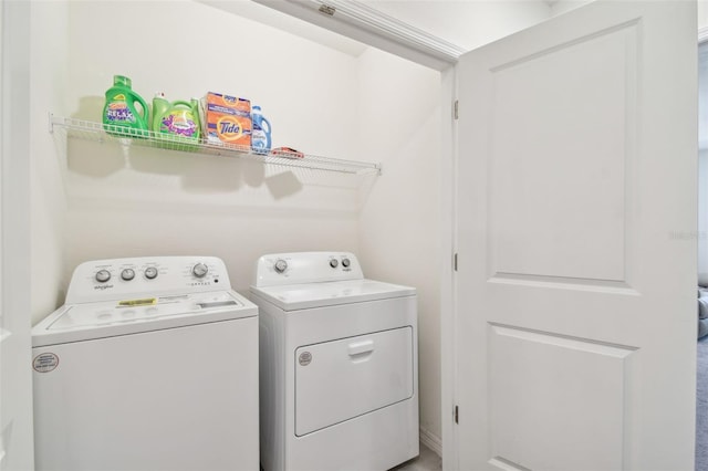 laundry room featuring washing machine and clothes dryer