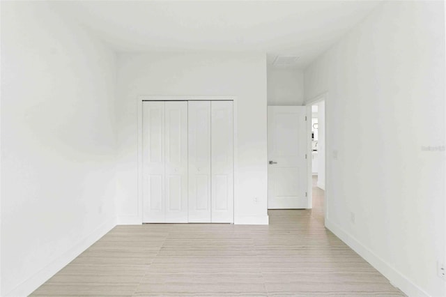 unfurnished bedroom featuring a closet