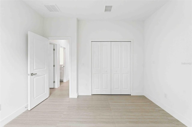 unfurnished bedroom with a closet