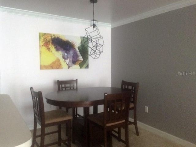 dining space featuring ornamental molding