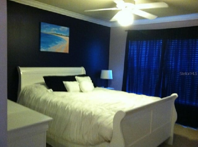 bedroom featuring ceiling fan and ornamental molding