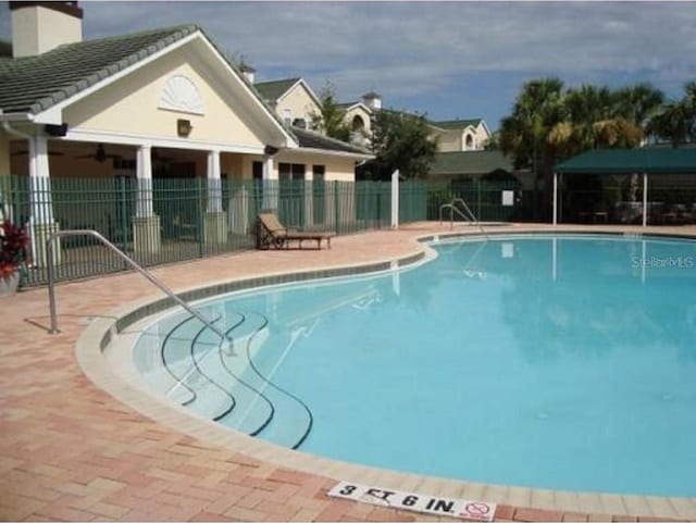 view of swimming pool featuring a patio area