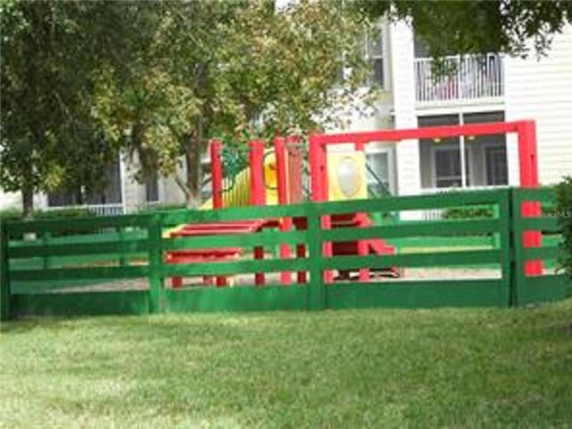 view of gate featuring a lawn