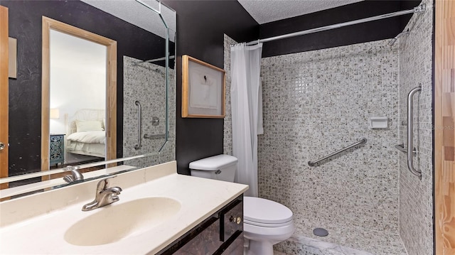 bathroom featuring vanity, toilet, curtained shower, and a textured ceiling