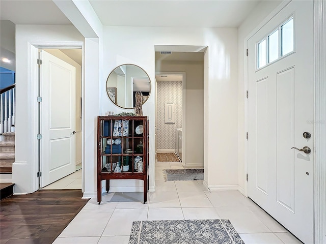 entrance foyer featuring light tile patterned floors