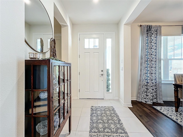 entrance foyer with light tile patterned flooring