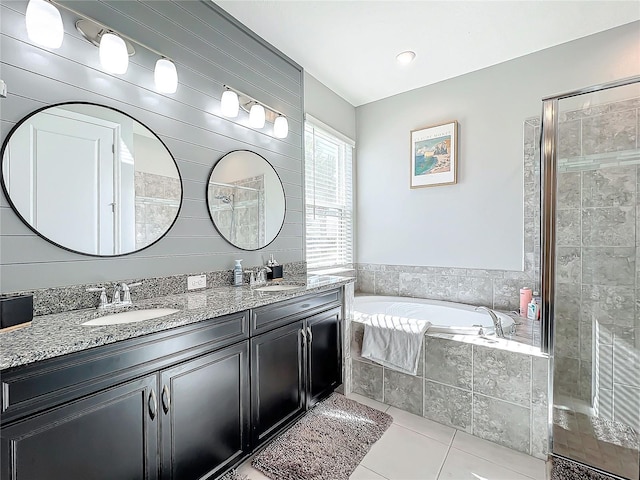 bathroom featuring vanity, separate shower and tub, and tile patterned floors