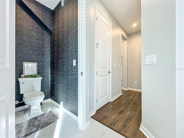 bathroom featuring tile patterned flooring and toilet