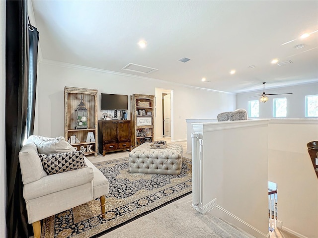 carpeted living room featuring ornamental molding