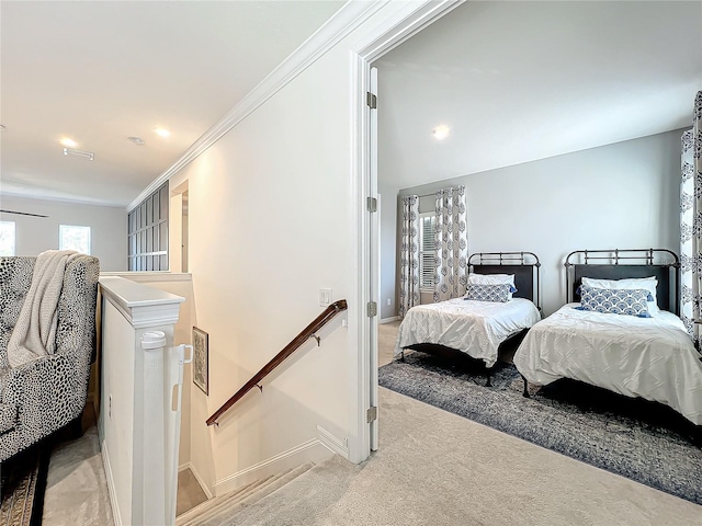 carpeted bedroom featuring crown molding