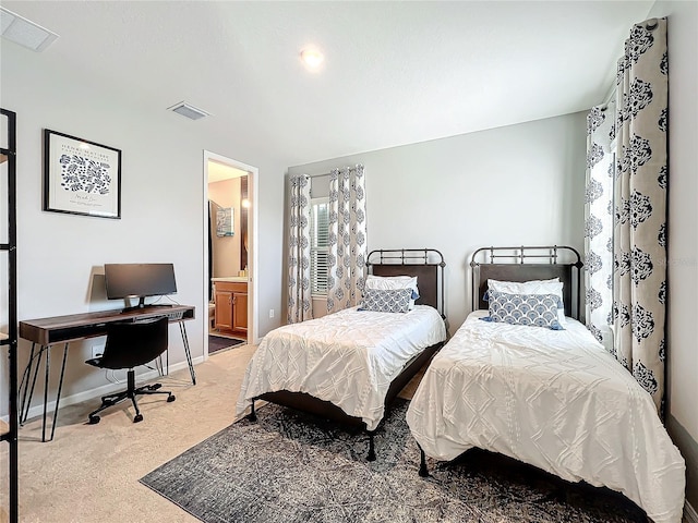 carpeted bedroom featuring connected bathroom