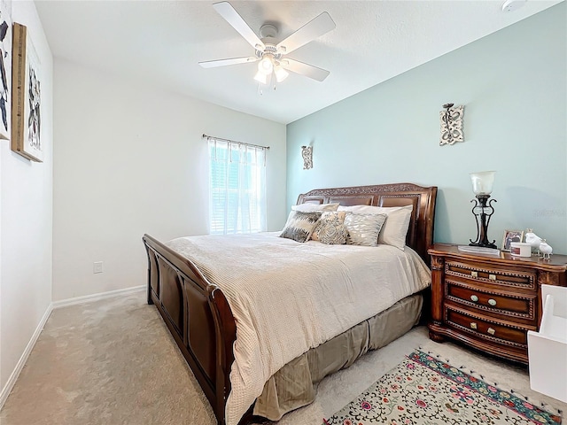 bedroom featuring light carpet and ceiling fan