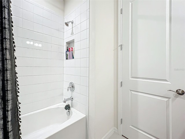 bathroom with shower / tub combo with curtain