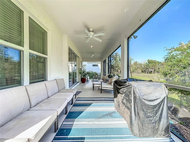 sunroom / solarium with ceiling fan