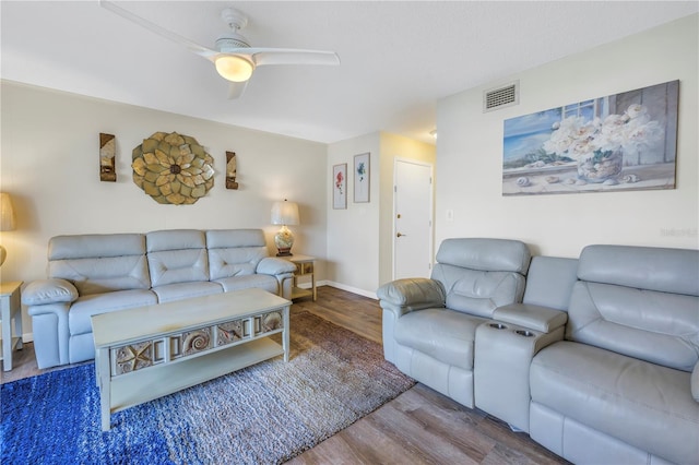 living room with ceiling fan and wood-type flooring