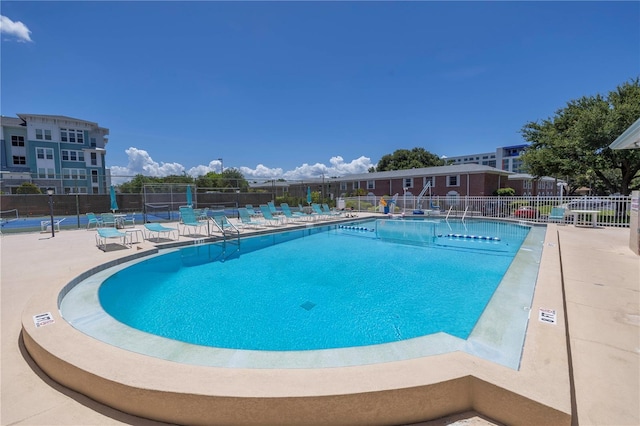 view of swimming pool with a patio area