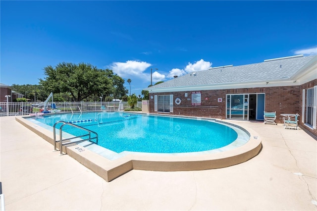 view of swimming pool featuring a patio area