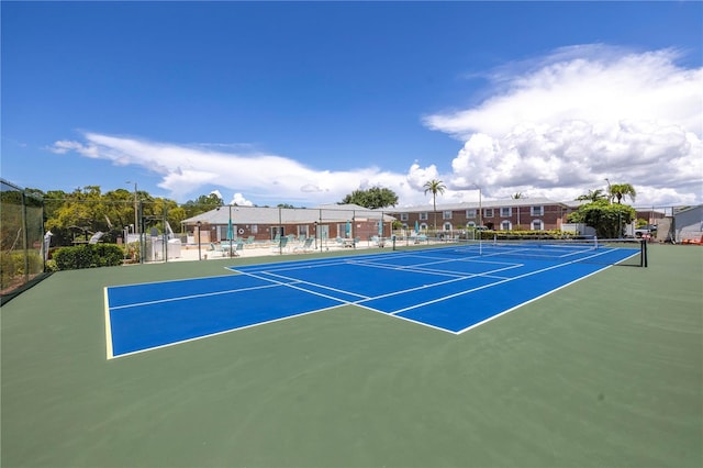 view of sport court with basketball hoop