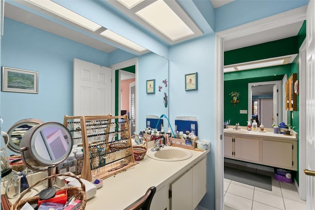 bathroom with tile patterned flooring and vanity