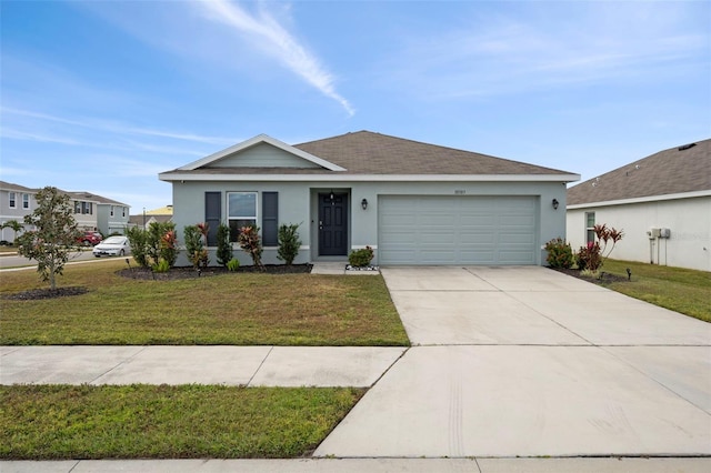 ranch-style house featuring a front yard and a garage