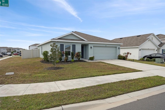 ranch-style home with a front yard and a garage