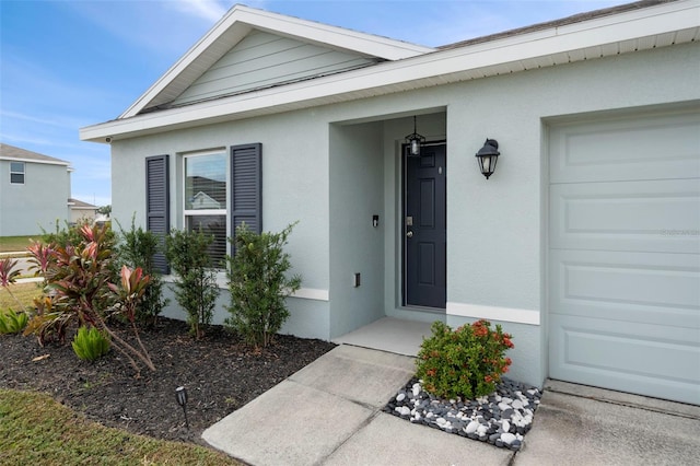 doorway to property featuring a garage