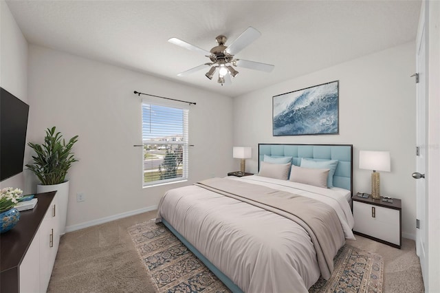 bedroom featuring light carpet and ceiling fan