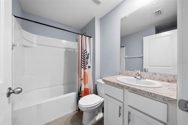 full bathroom with vanity, shower / bath combination with curtain, a textured ceiling, and toilet