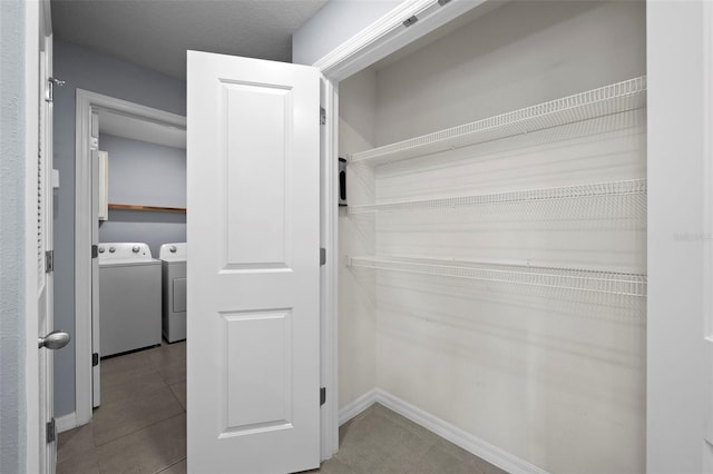 closet featuring washer and clothes dryer