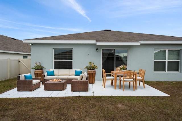 back of property featuring a patio area, an outdoor hangout area, and a yard