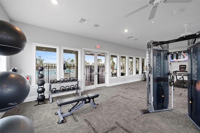 gym with ceiling fan, french doors, and carpet floors