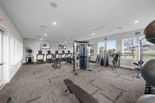 gym with light colored carpet and ceiling fan