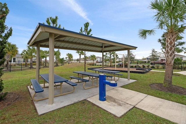 view of property's community with a gazebo and a yard