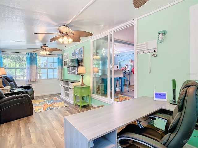 office area with ceiling fan and light hardwood / wood-style flooring