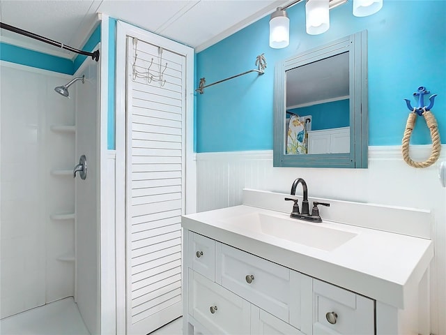 bathroom with vanity and a shower