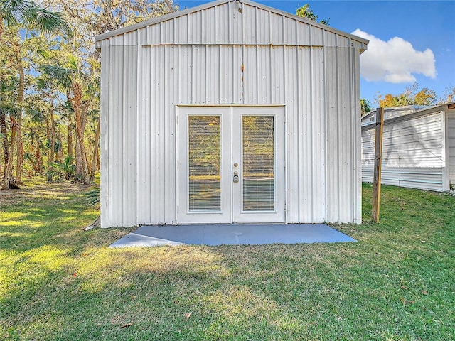 view of outbuilding featuring a lawn