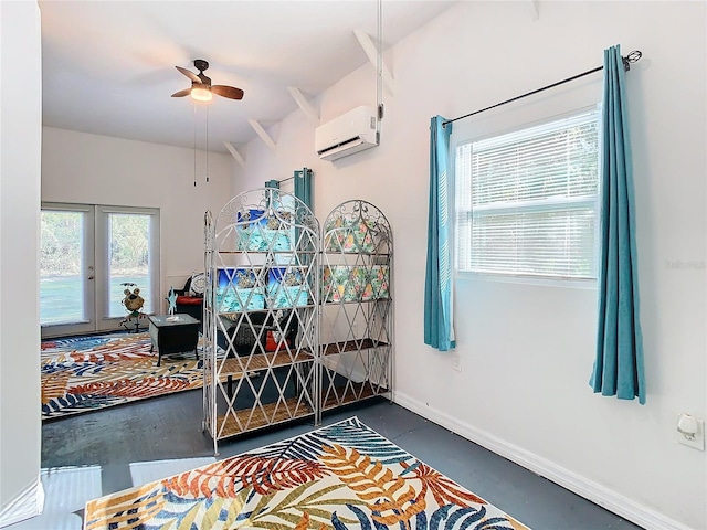 bedroom with ceiling fan, french doors, and a wall mounted air conditioner