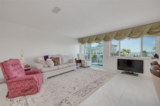 living room with marble finish floor and visible vents