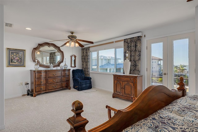 bedroom with light carpet, baseboards, visible vents, a ceiling fan, and access to exterior