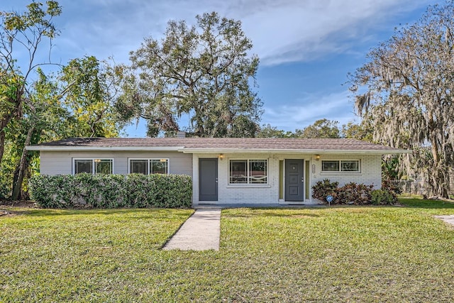 ranch-style home with a front yard