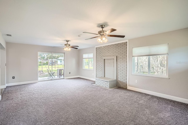 unfurnished living room featuring carpet and ceiling fan