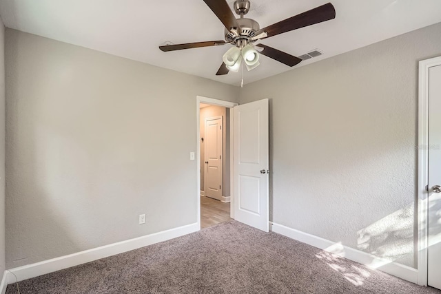 unfurnished bedroom featuring ceiling fan and light carpet