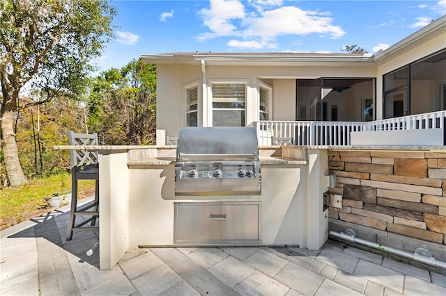 view of patio / terrace with an outdoor kitchen and grilling area