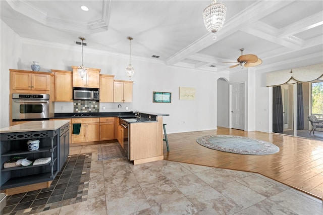 kitchen featuring sink, stainless steel appliances, coffered ceiling, light hardwood / wood-style floors, and ornamental molding